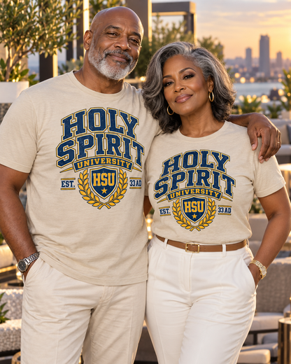 Holy Spirit University Emblem Tee featuring a dove and flame emblem above an open book, encircled in gold